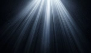 Rays of ethereal light descend from an unseen source above, illuminating the darkness below. This creates a sense of wonder, awe, and the possibility of something greater beyond the visible.